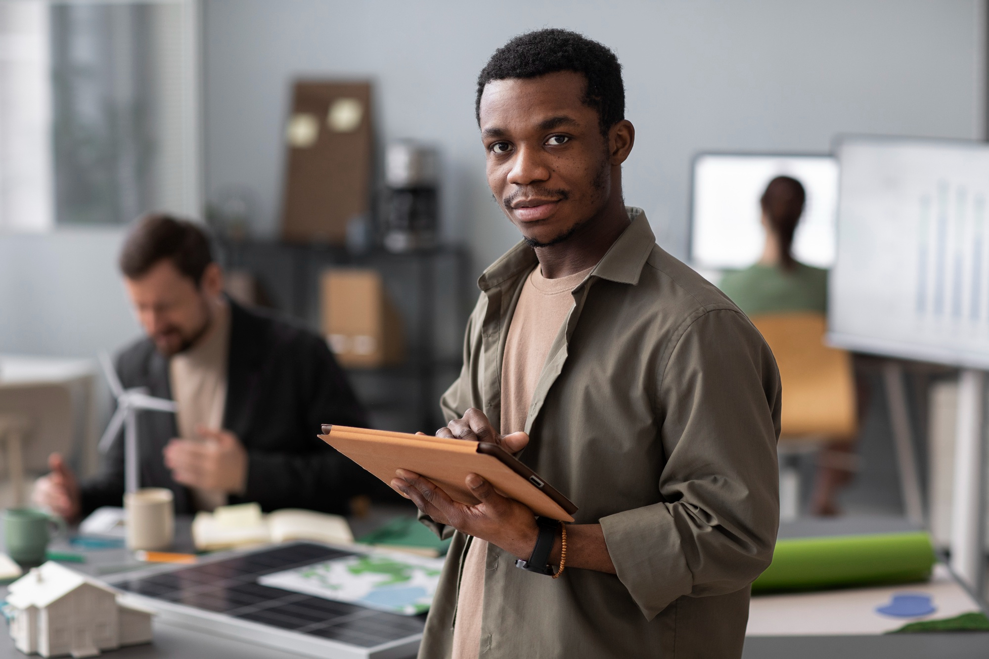 Young professional with tablet in a creative workspace
